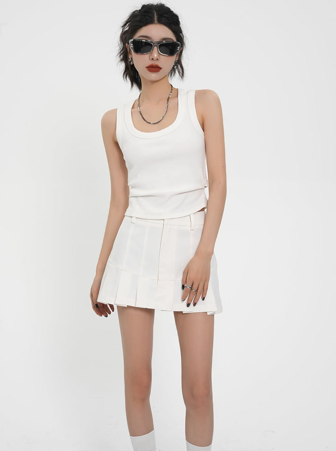 Flirty Flare Duo: Crisp White Pleated Tennis Skort & Textured Black Tiered Mini Skirt Set