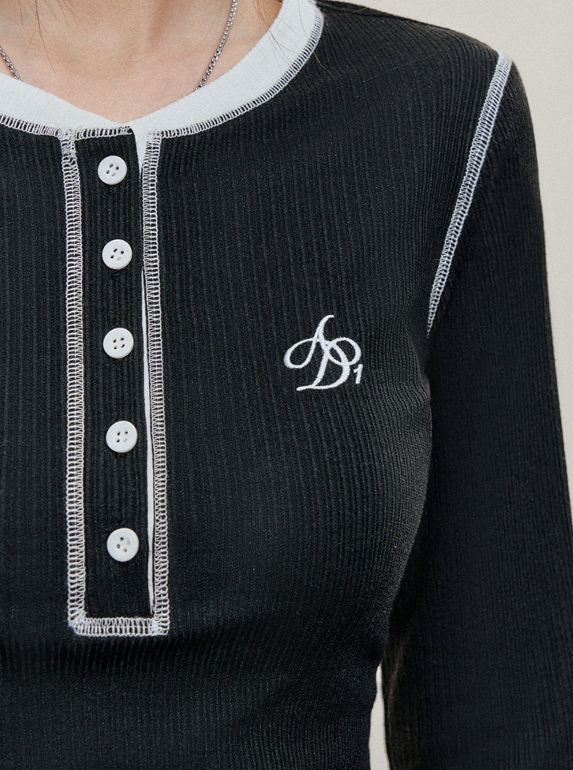 Contrast Trim Long Sleeve Henley: Black Fitted Top with White Accents and Embroidered Logo