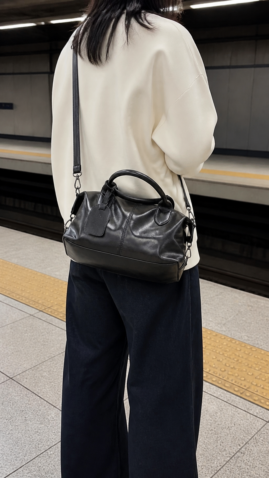 Midnight Transit Leather Weekender on a casual station platform commute