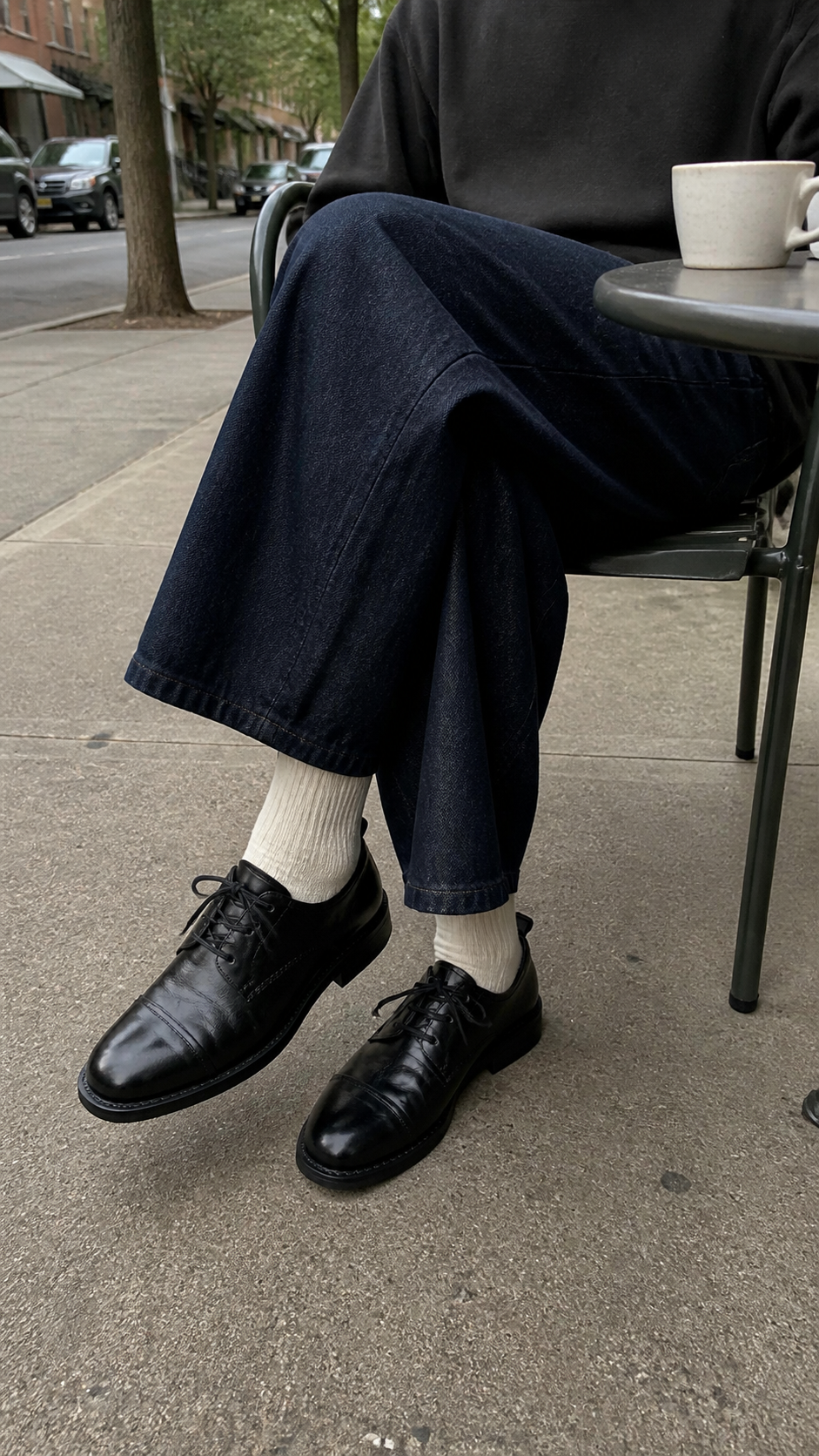 Obsidian Square Oxford Shoes styled at a sidewalk cafe
