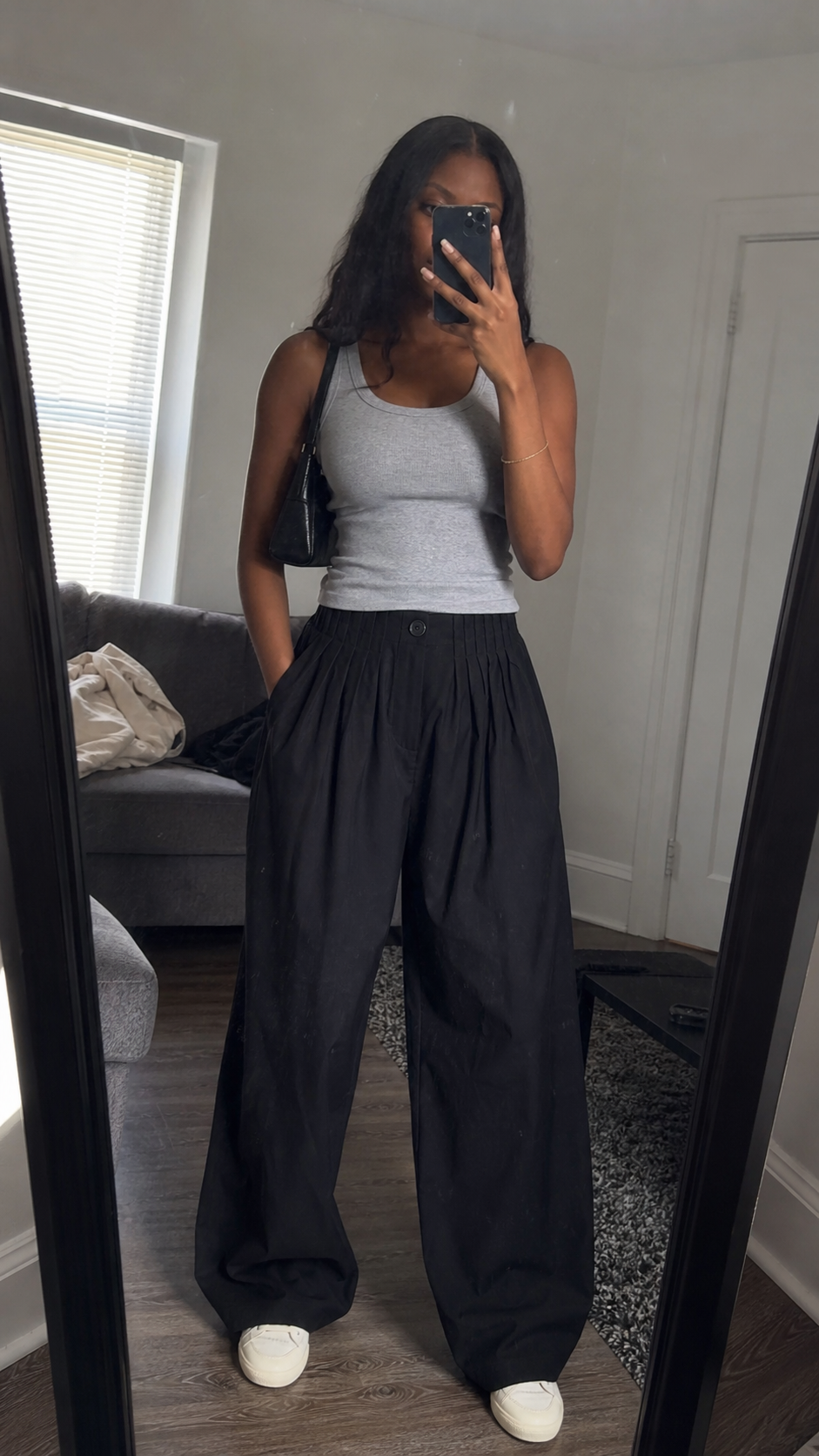 Pleated Waist Black Wide-Leg Trousers in a natural apartment mirror fit check
