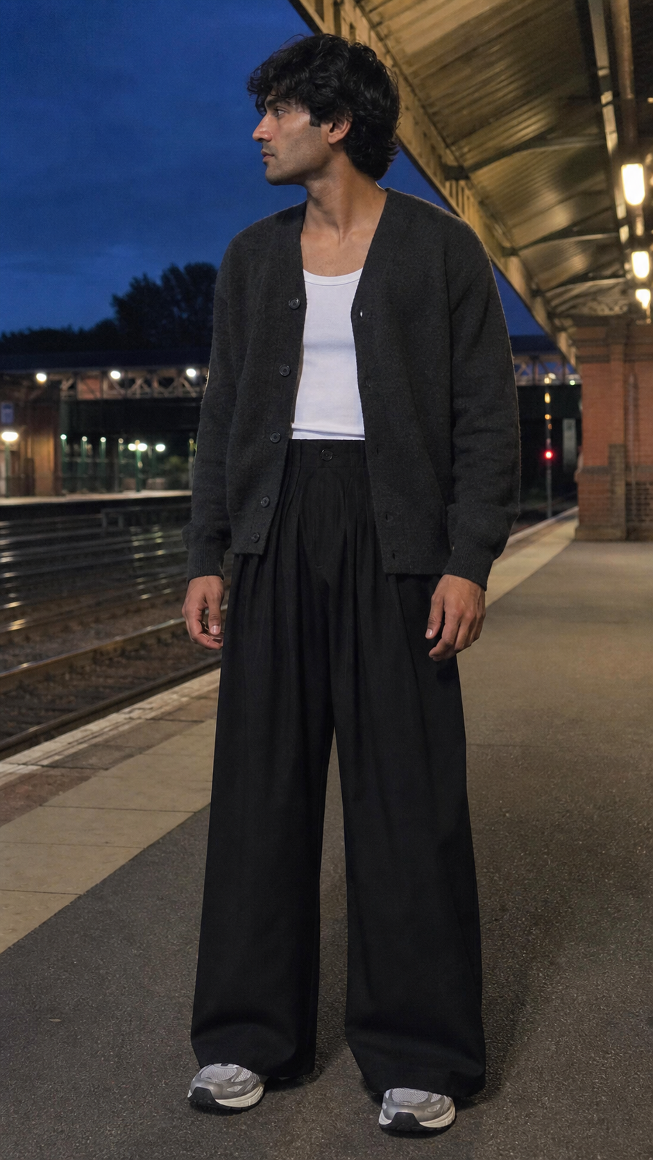 Pleated Waist Black Wide-Leg Trousers styled naturally at a train platform