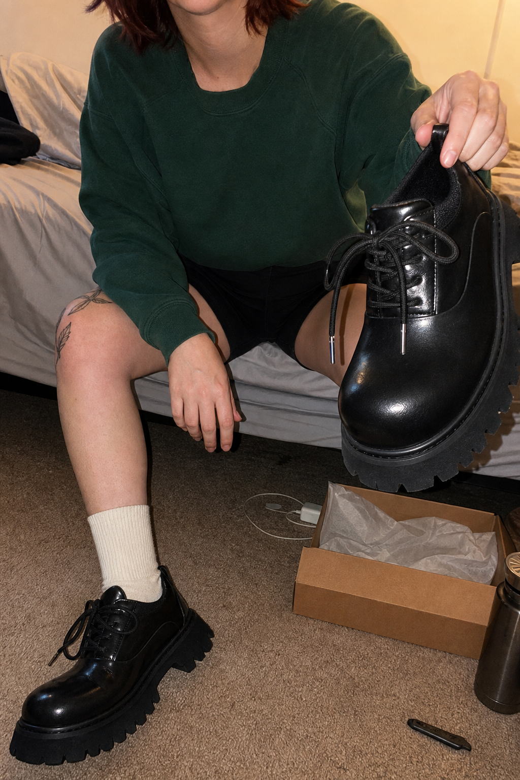 UGC bedroom try-on of Chunky Black Leather Lug Sole Derby Shoes