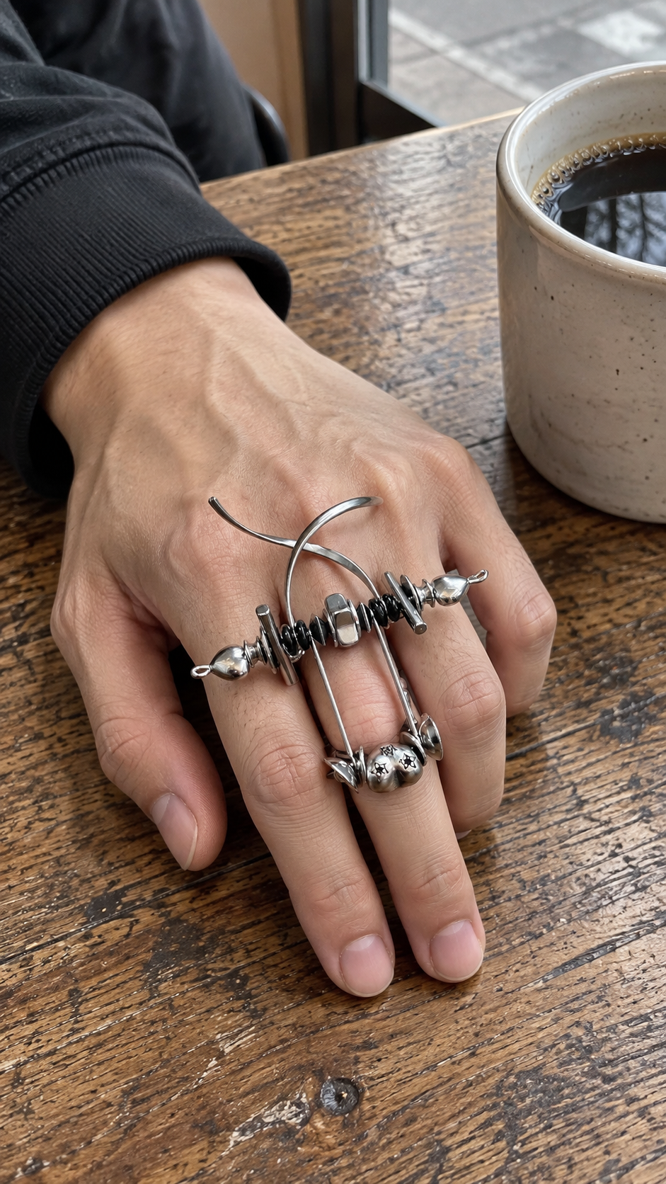 AI-styled look: Danger Signal Adjustable Ring — Cafe tabletop