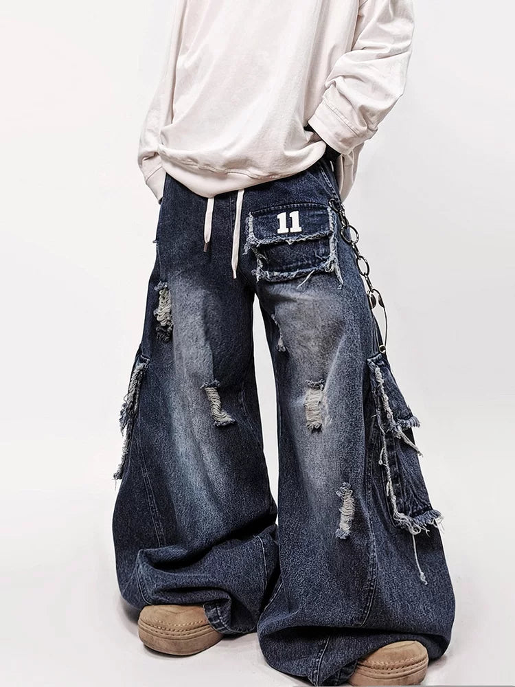 Oversized blue jeans with distressed patch pockets