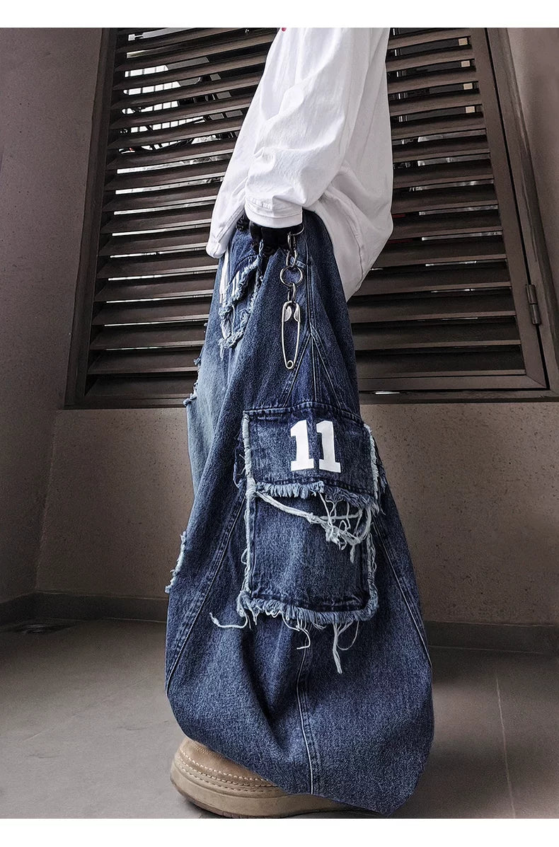 Distressed pocket and number patch detail on wide-leg jeans