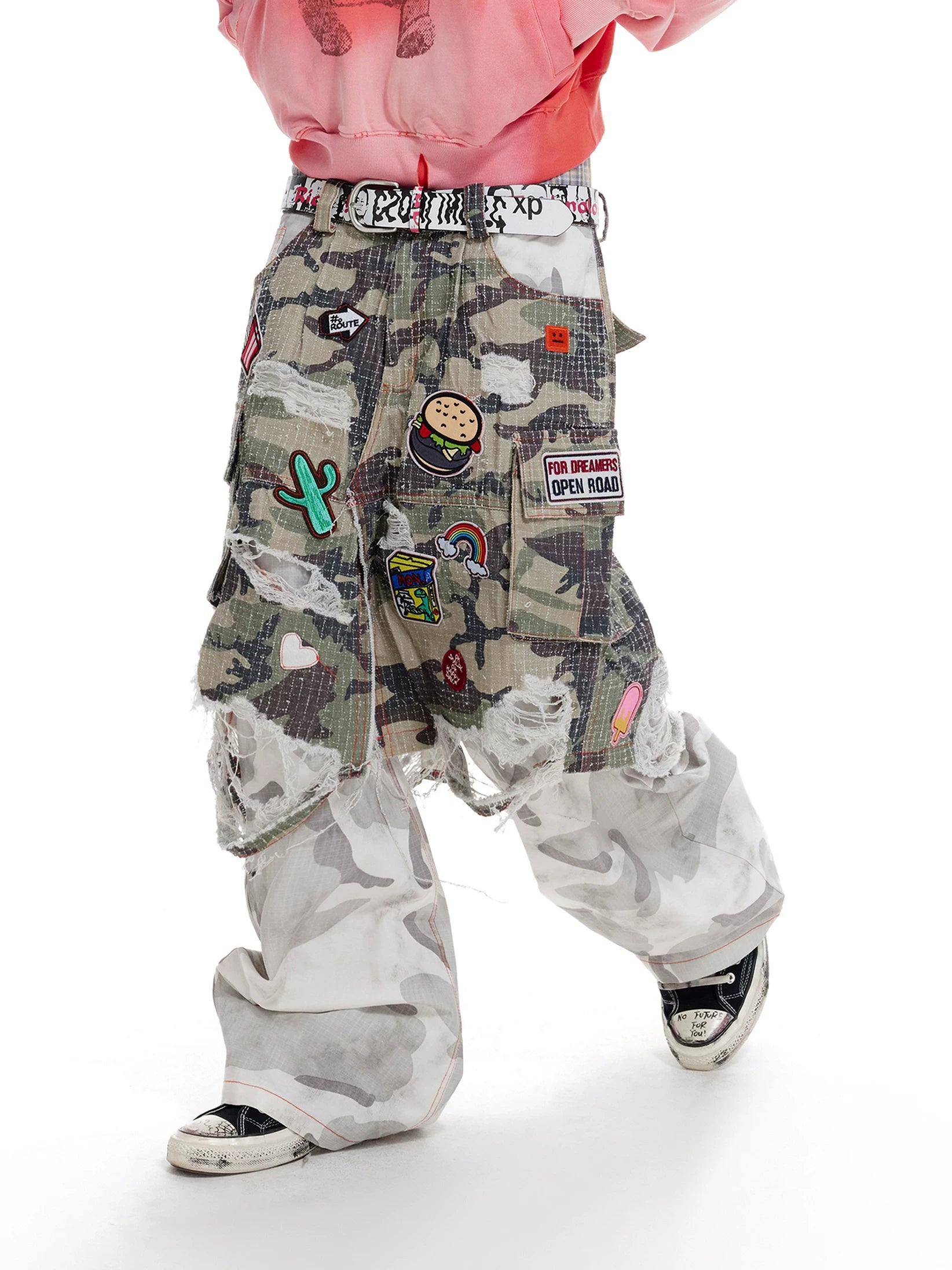 Distressed patchwork camouflage cargo pants detail view