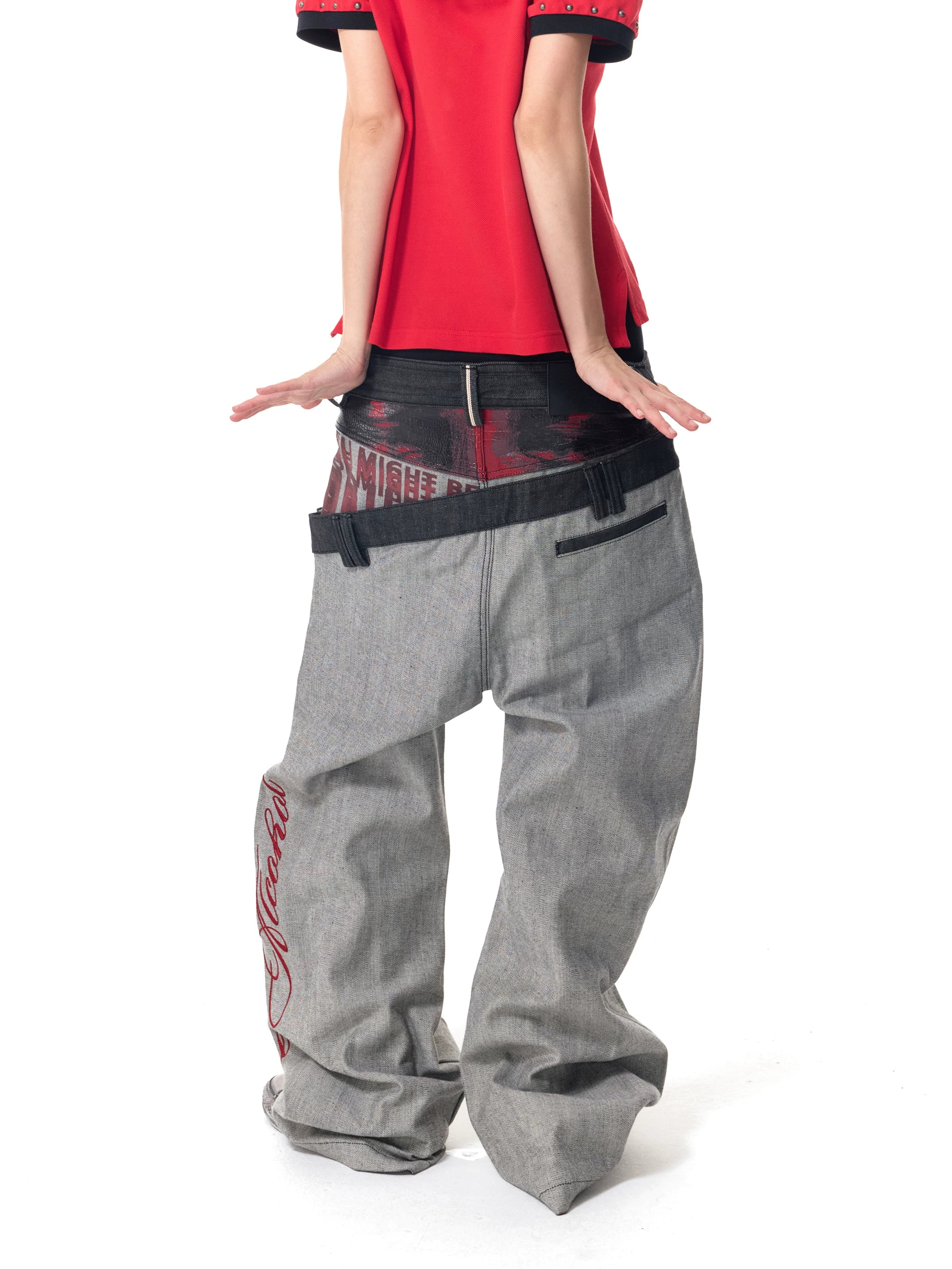 Gray curve-leg jeans back studio styling