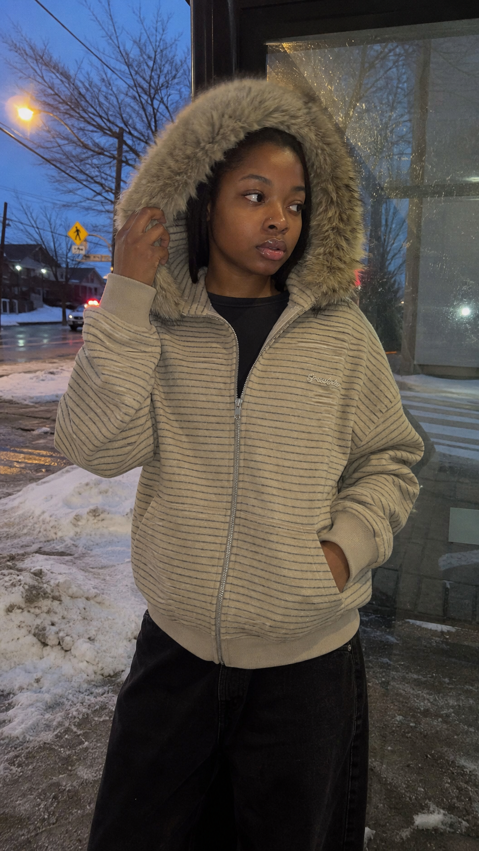 Frostline Striped Faux Fur Hoodie UGC snowy bus stop