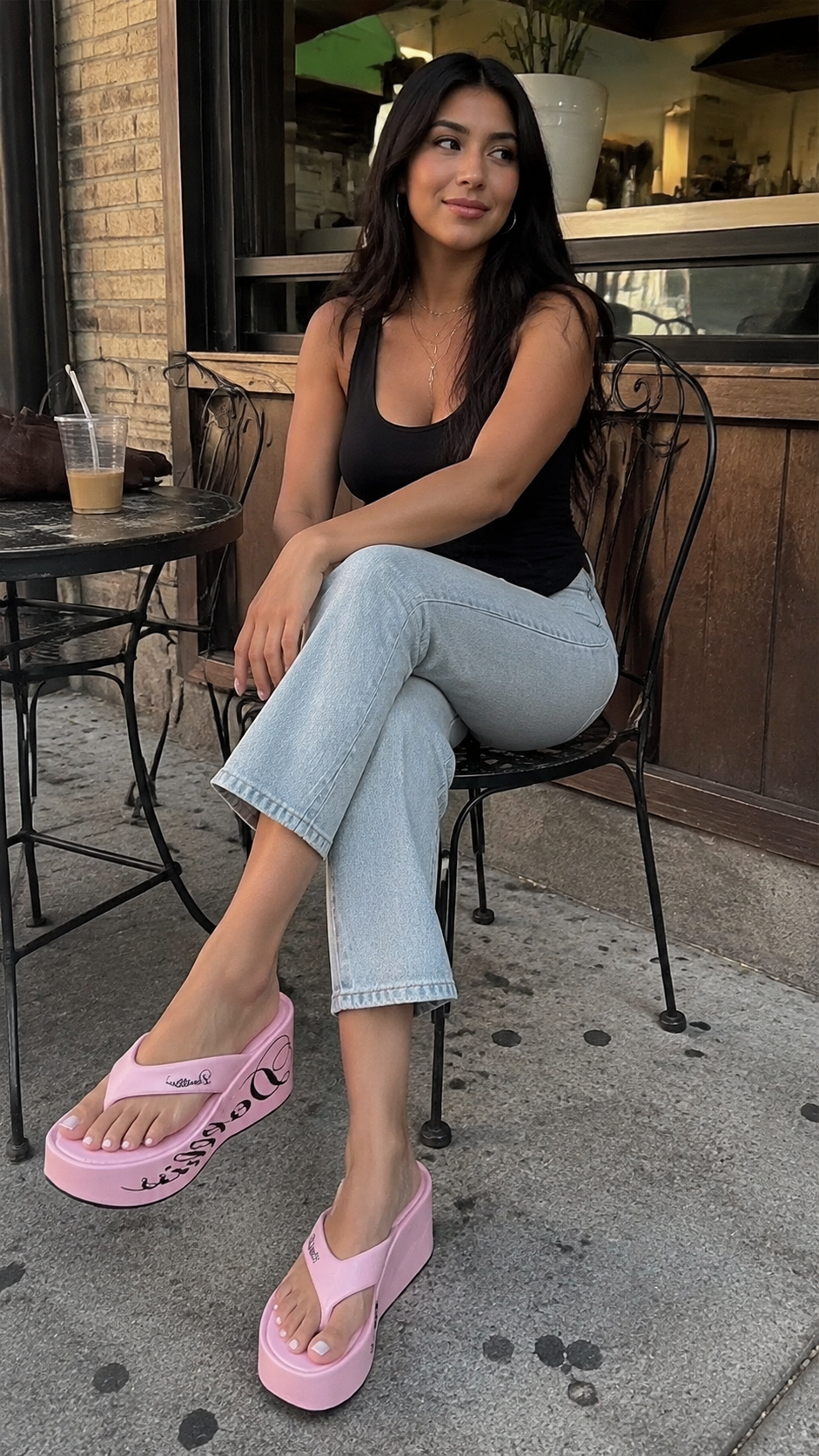 Logo-Print 10cm Platform Wedge Flip-Flops in pink styled at an outdoor cafe