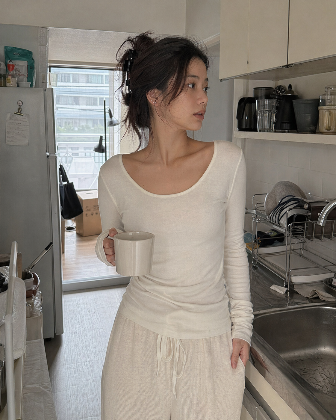UGC showcase 4 for Long Sleeve Basic Tee: Asian woman in a Tokyo apartment kitchen.
