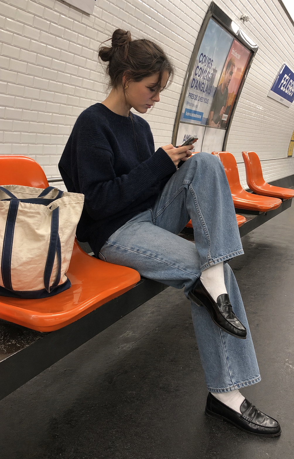 UGC showcase 2 for Skyfade Straight Leg Jeans: French woman on a Paris metro platform.