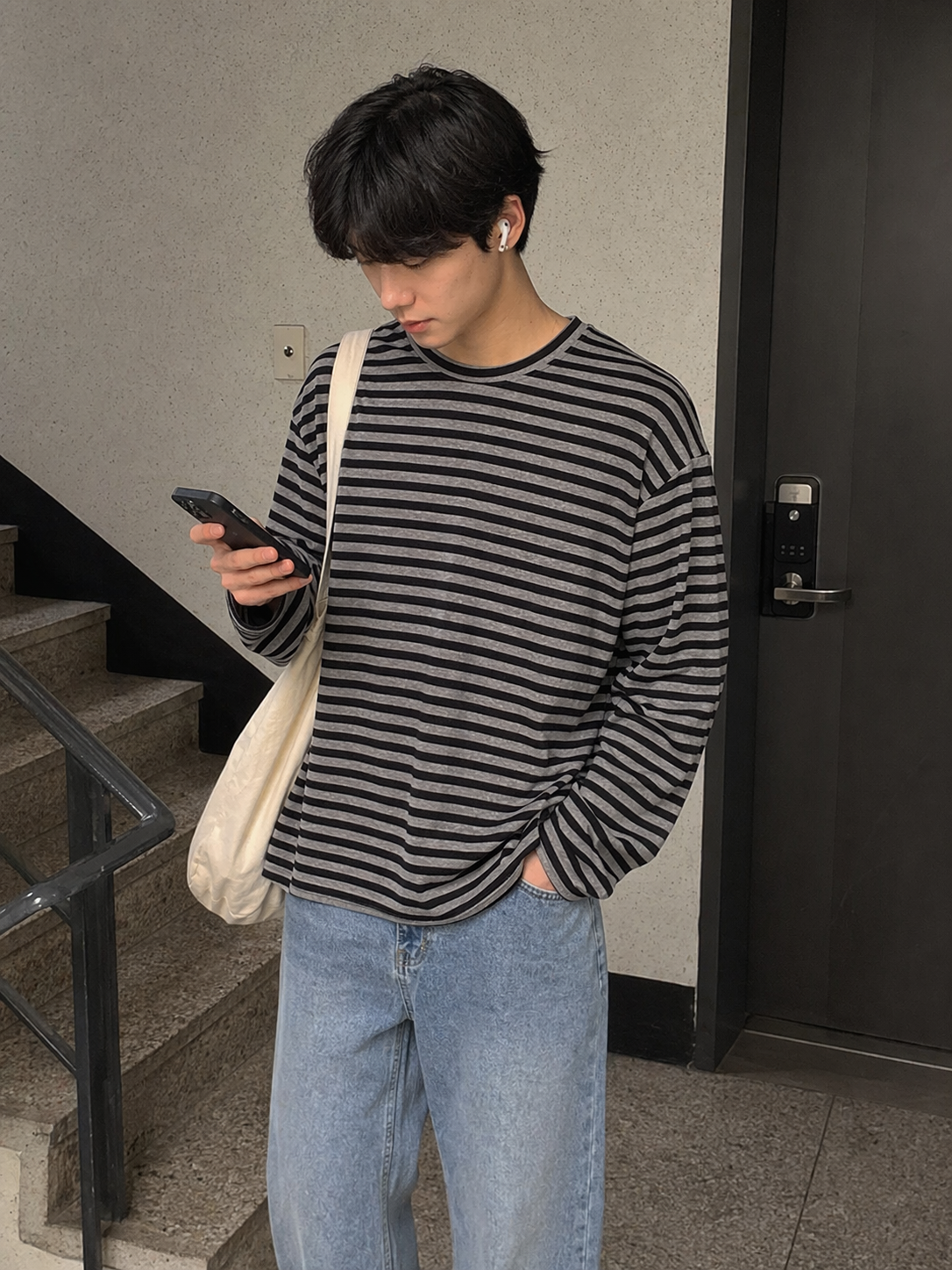 UGC showcase 4 for Tide Slouch Stripe Long Sleeve Tee: Korean man in a Seoul apartment hallway.