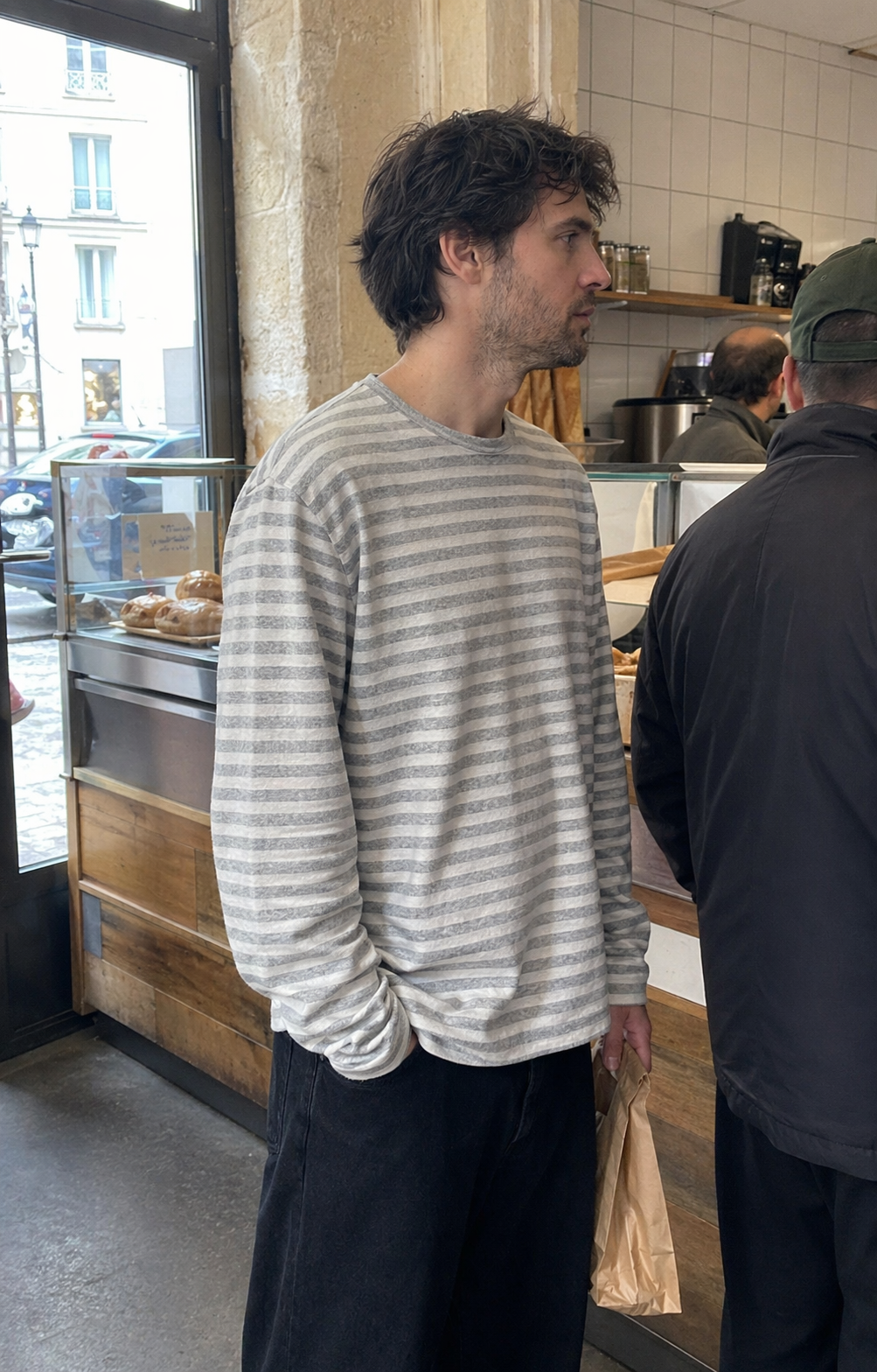 UGC showcase 5 for Tide Slouch Stripe Long Sleeve Tee: French man in a Paris bakery queue.