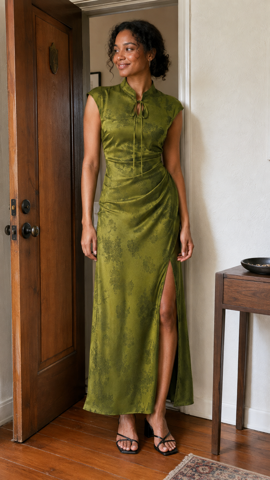 Verdant Whispers Cheongsam Maxi Dress — A casual photo by the front door. Pine Moss Green.