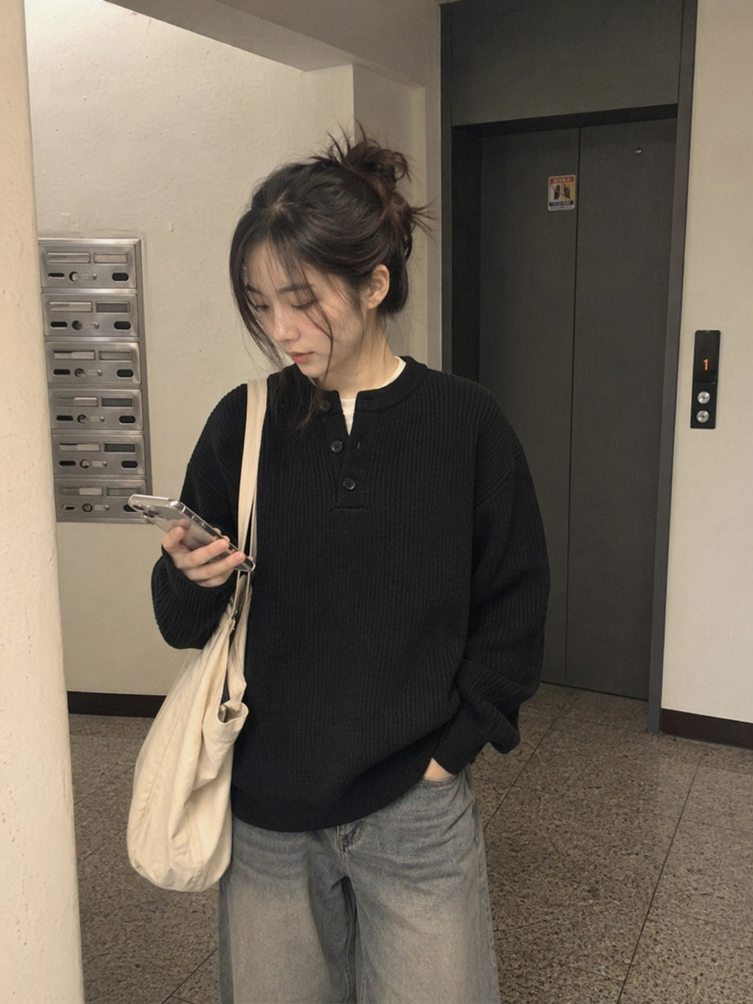 UGC showcase 4 for Waffle Henley Knit Sweater: Korean woman in a Seoul apartment hallway.